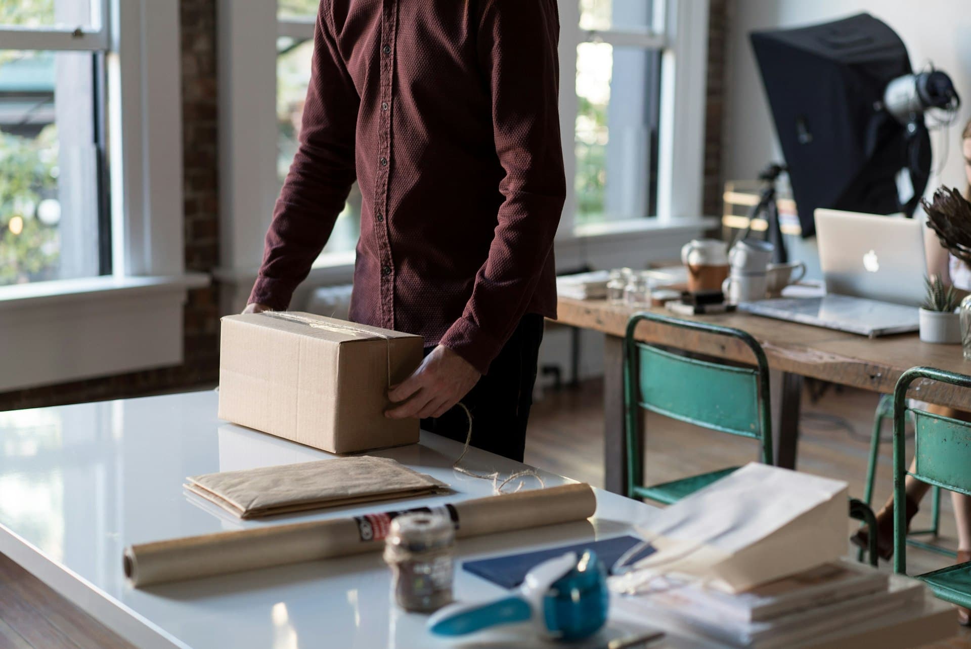 Small business owner packing an online order